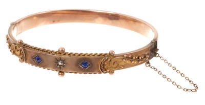 Lot 687 - Edwardian 9ct gold diamond and synthetic sapphire hinged bangle (Chester 1908)