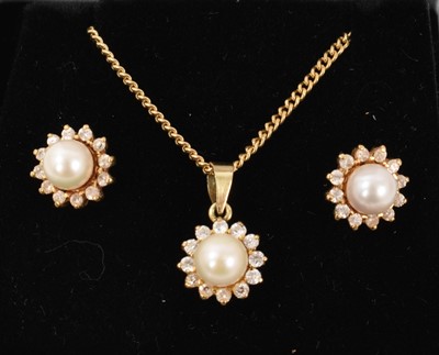 Lot 692 - Cultured pearl and diamond cluster earrings and matching pendant in gold setting