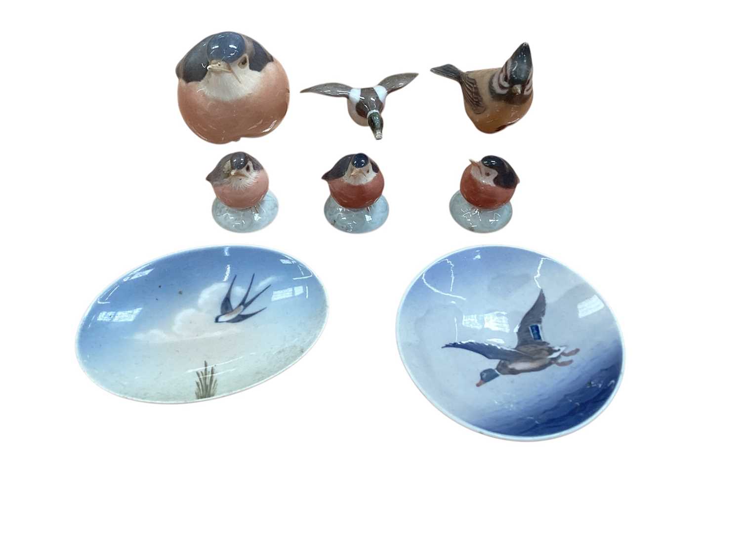 Lot 935 - Six Royal Copenhagen porcelain model birds, together with two dishes (8)