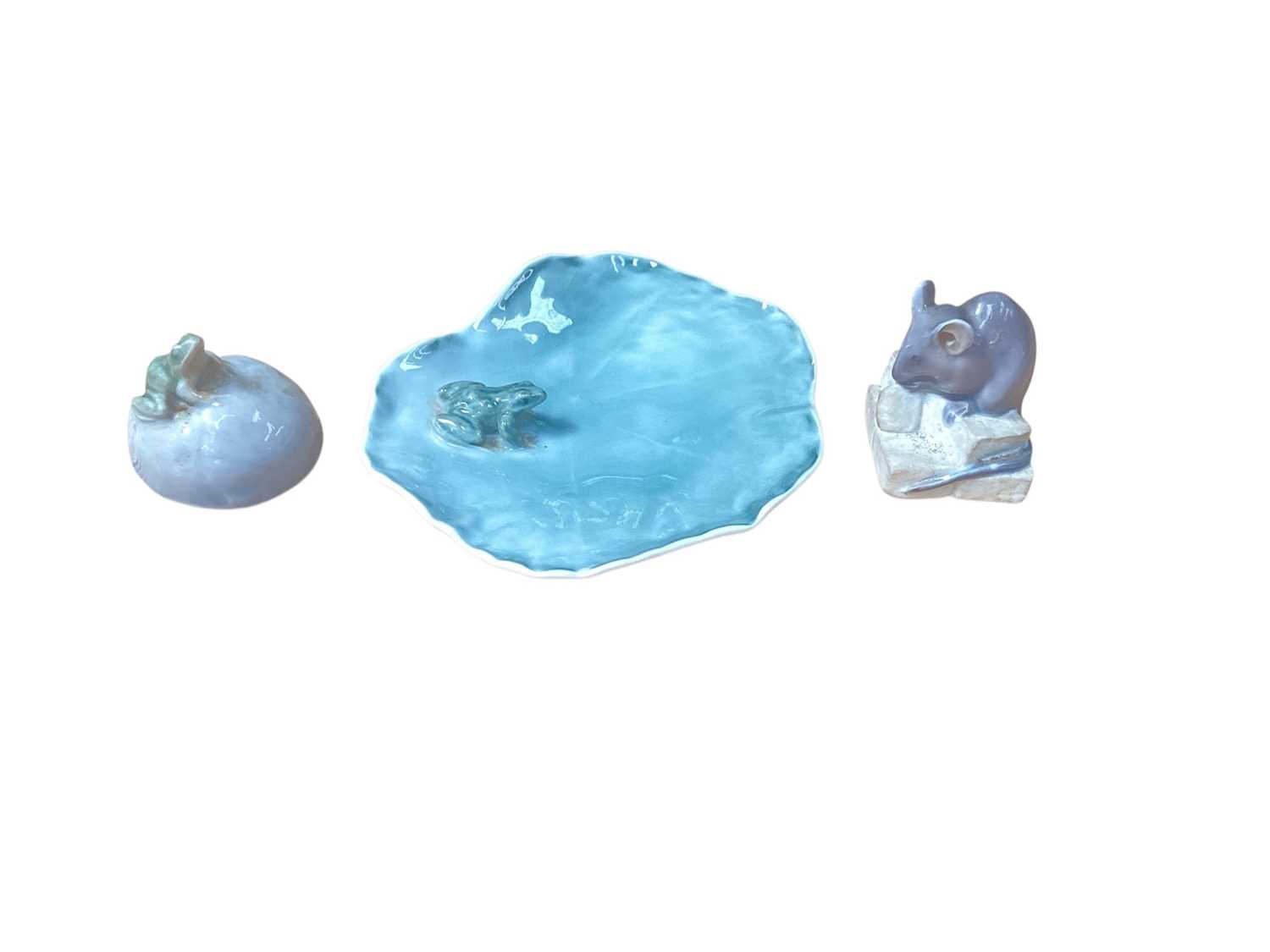 Lot 936 - Royal Copenhagen porcelain model of a frog on a Lilly pad, no. 2247, together with a mouse on sugar cubes, no. 510 and a frog on a stone, no. 507 (3)