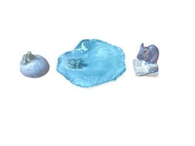 Lot 936 - Royal Copenhagen porcelain model of a frog on a Lilly pad, no. 2247, together with a mouse on sugar cubes, no. 510 and a frog on a stone, no. 507 (3)