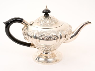 Lot 426 - Edwardian silver teapot of inverted baluster form, with embossed foliate decoration
