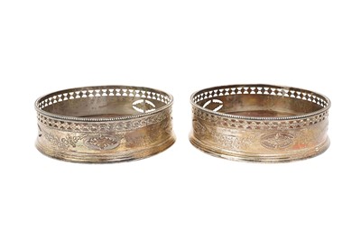 Lot 535 - Pair of Georgian silver wine coasters