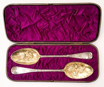 Lot 511 - Two silver berry spoons in a fitted case