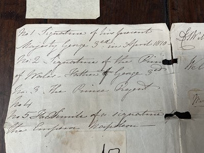 Lot 914 - Collection of signatures, stuck to a folded sheet of laid paper, annotated with some of the signatures - No 1 - signature of his majesty George 3rd in April 1810; No 2 - Signature of a the Princ...