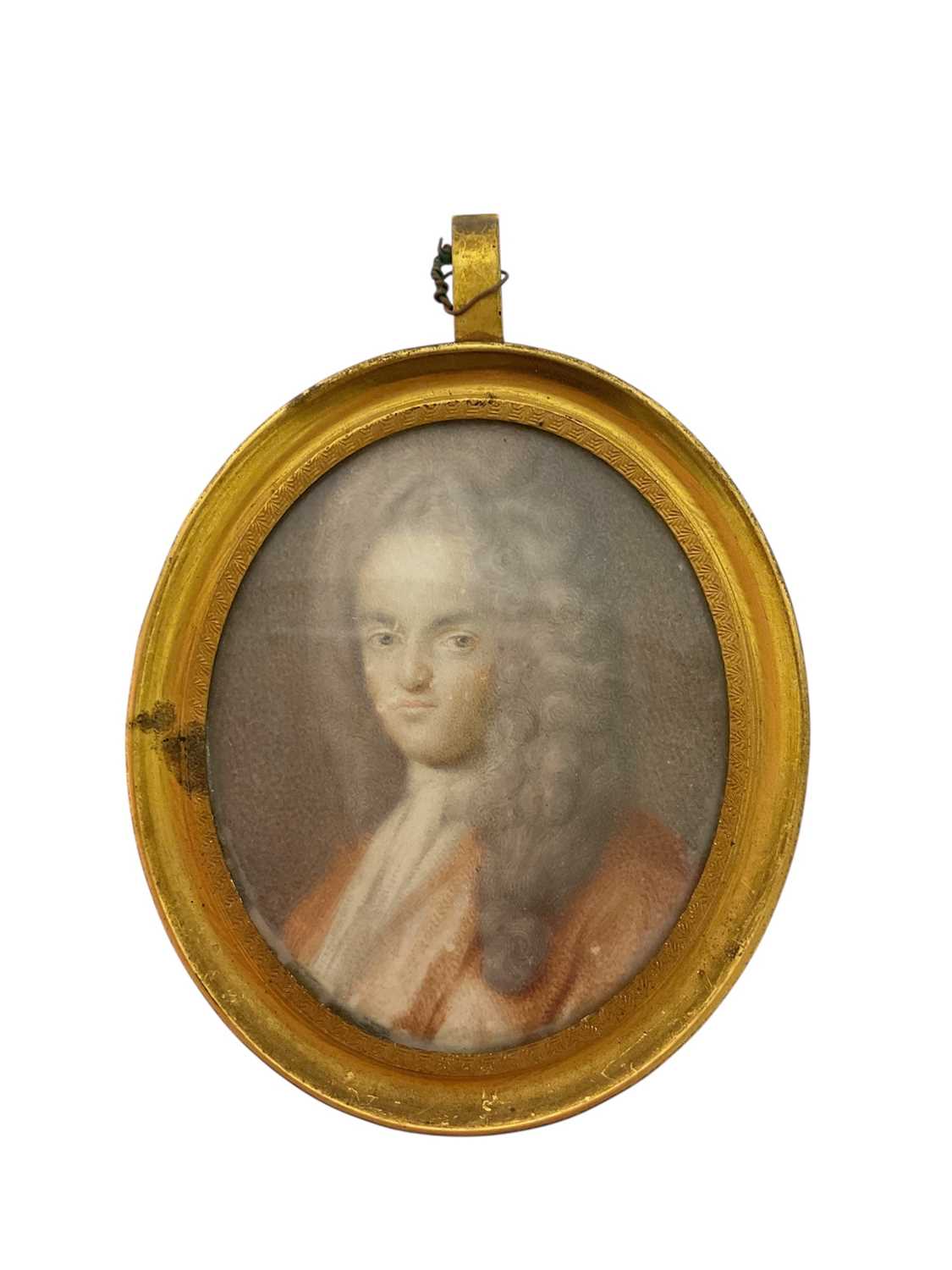 Lot 903 - Early 18th century watercolour portrait miniature on paper, depicting a gentleman in high wig, inscribed to rear 'one of the Charleton ancestors', oval, 6.5 x 5.5cm