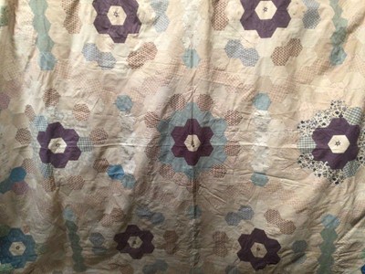 Lot 2061 - 1934 handmade patchwork quilt in flower garden design.