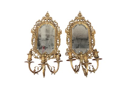 Lot 1443 - Pair of gilt metal three light girandoles