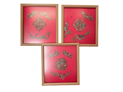Lot 597 - Three Chinese embroidered fragments in glazed frames, 23.5cm x 20.5cm overall