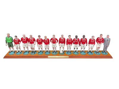 Lot 360 - Danbury Mint Manchester United Champions of Europe 1999 set of figurines on wooden stand