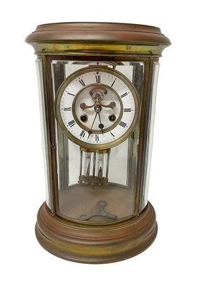 Lot 620 - French oval brass cased four glass mantel clock
