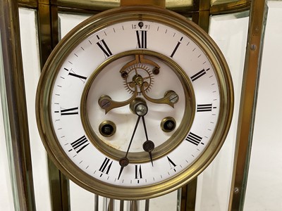 Lot 620 - French oval brass cased four glass mantel clock