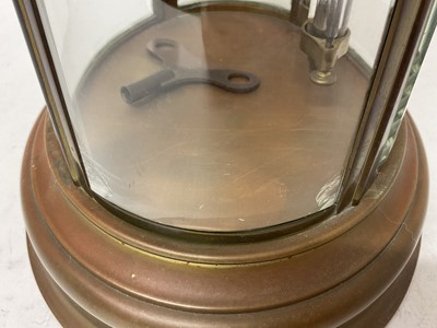 Lot 620 - French oval brass cased four glass mantel clock