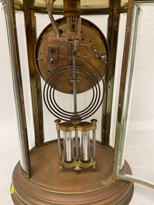 Lot 620 - French oval brass cased four glass mantel clock