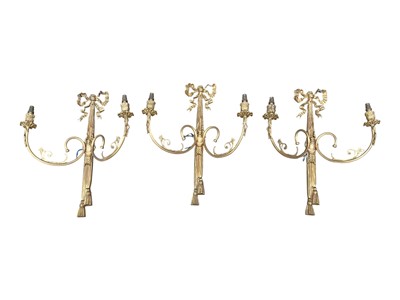 Lot 1333 - Set of three gilt metal two branch wall lights