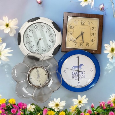 Lot 613 - Four quartz wall clocks