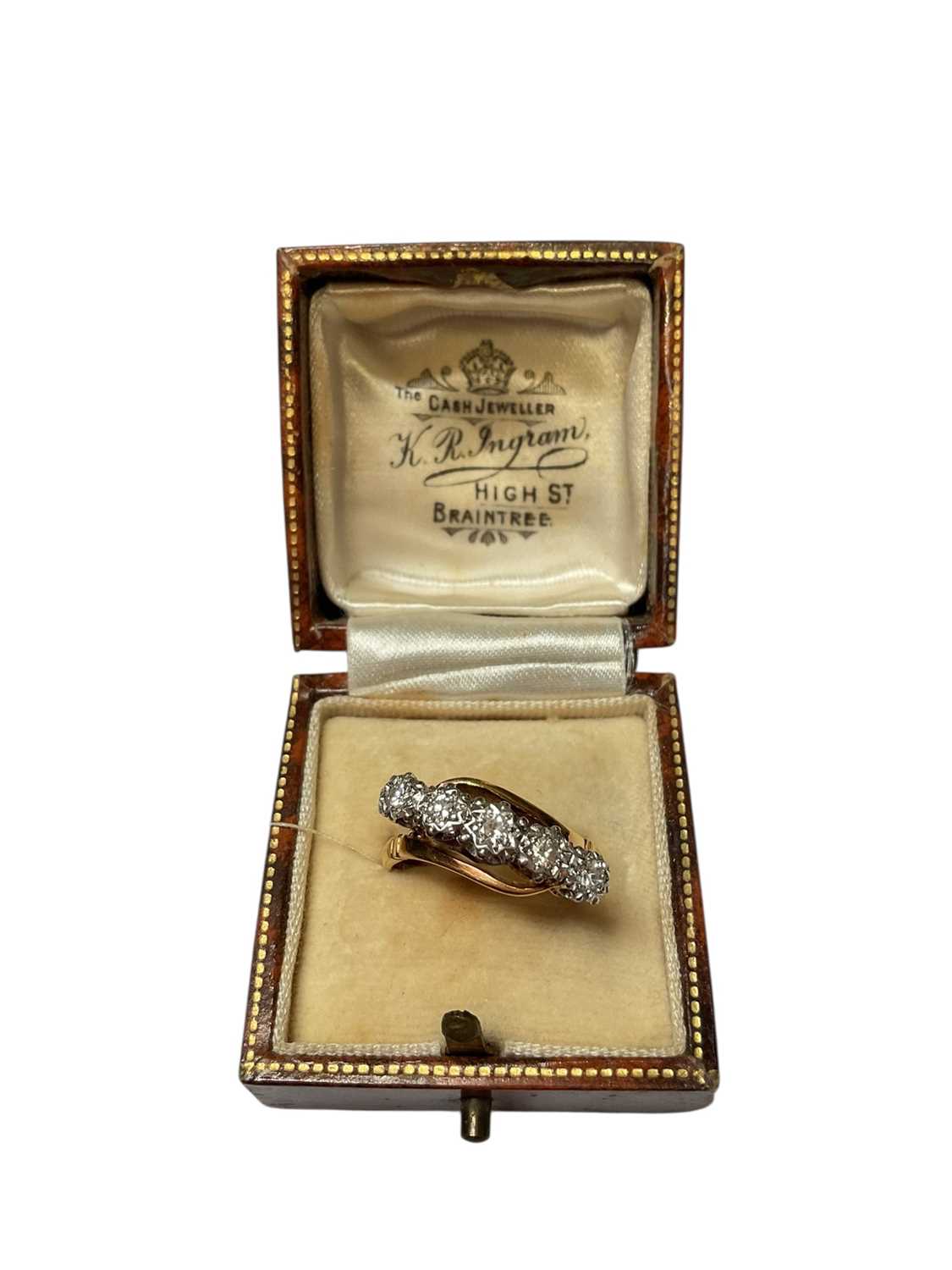 Lot 75 - 1930s diamond five stone ring in platinum crossover illusion setting on 18ct gold shank, stamped 'Bravingtons'.