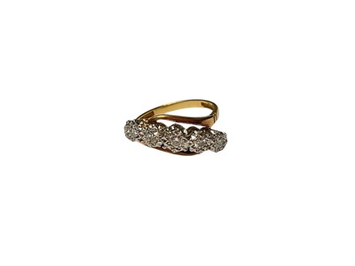 Lot 75 - 1930s diamond five stone ring in platinum crossover illusion setting on 18ct gold shank, stamped 'Bravingtons'.