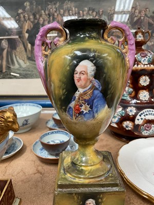 Lot 22 - Two Vienna porcelain twin handled vases, including one with Royal portraits, the other painted with figures in a landscape