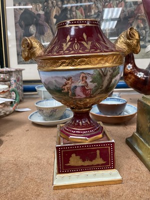 Lot 22 - Two Vienna porcelain twin handled vases, including one with Royal portraits, the other painted with figures in a landscape
