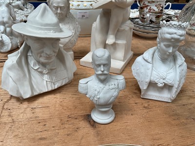 Lot 24 - Plaster figure of a child writing, together with a Coalport bust of Baden-Powell, and Parian ware busts of Queen Victorian, Queen Mary, and King George V (5)
