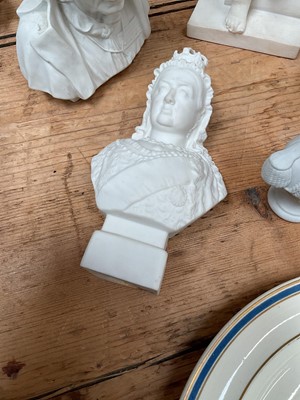 Lot 24 - Plaster figure of a child writing, together with a Coalport bust of Baden-Powell, and Parian ware busts of Queen Victorian, Queen Mary, and King George V (5)