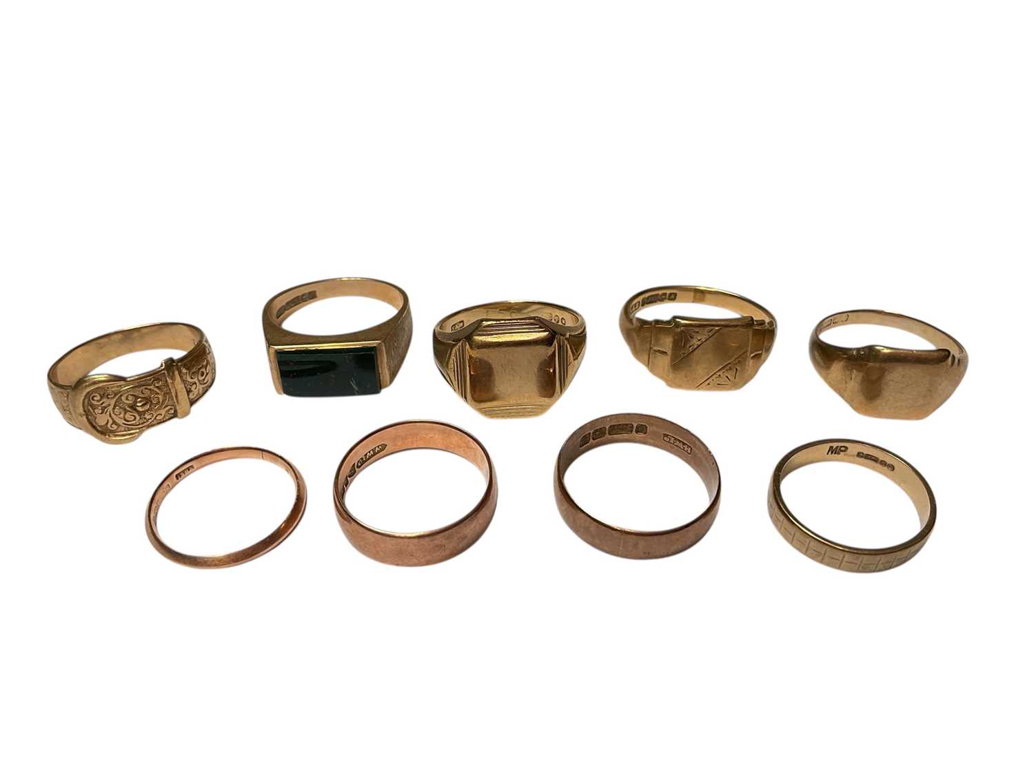 Lot 78 - Nine 9ct gold rings to include four signet rings, a buckle ring and four wedding bands