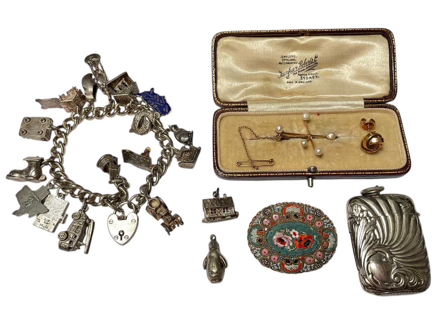 Lot 80 - Early 20th century gold and seed pearl 'Southern Cross' brooch, silver charm bracelet etc
