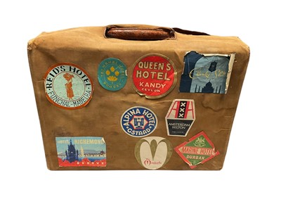 Lot 2072 - Vintage crocodile skin case with key, protective outer canvas case with luggage labels. width 45cms, height 45cms, depth 18cms