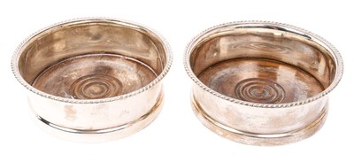 Lot 485 - Pair of silver wine coasters