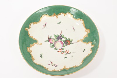 Lot 306 - Worcester green ground saucer dish, painted with ‘spotted’ fruit, circa 1775