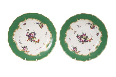 Lot 285 - Pair of Worcester green ground soup plates, painted with ‘spotted’ fruits, circa 1775