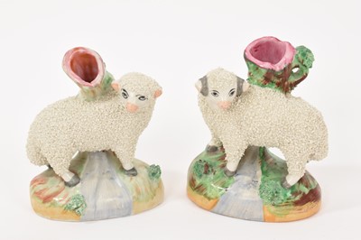 Lot 280 - Pair of Staffordshire pottery small sheep spill vases