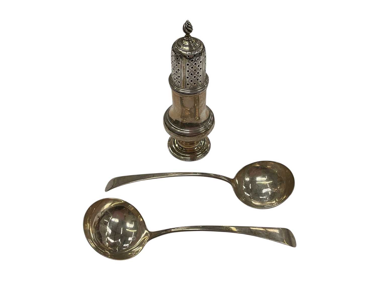 Lot 186 - Pair of George III silver Old English pattern sauce ladles, and a George III silver sugar castor (3)