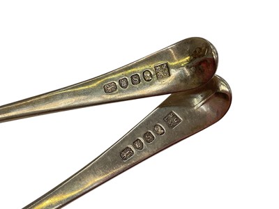 Lot 186 - Pair of George III silver Old English pattern sauce ladles, and a George III silver sugar castor (3)