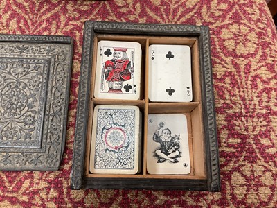 Lot 2544 - Glass advertising paperweight, an Indian carved wood playing card box and cards, and an embossed leather note book
