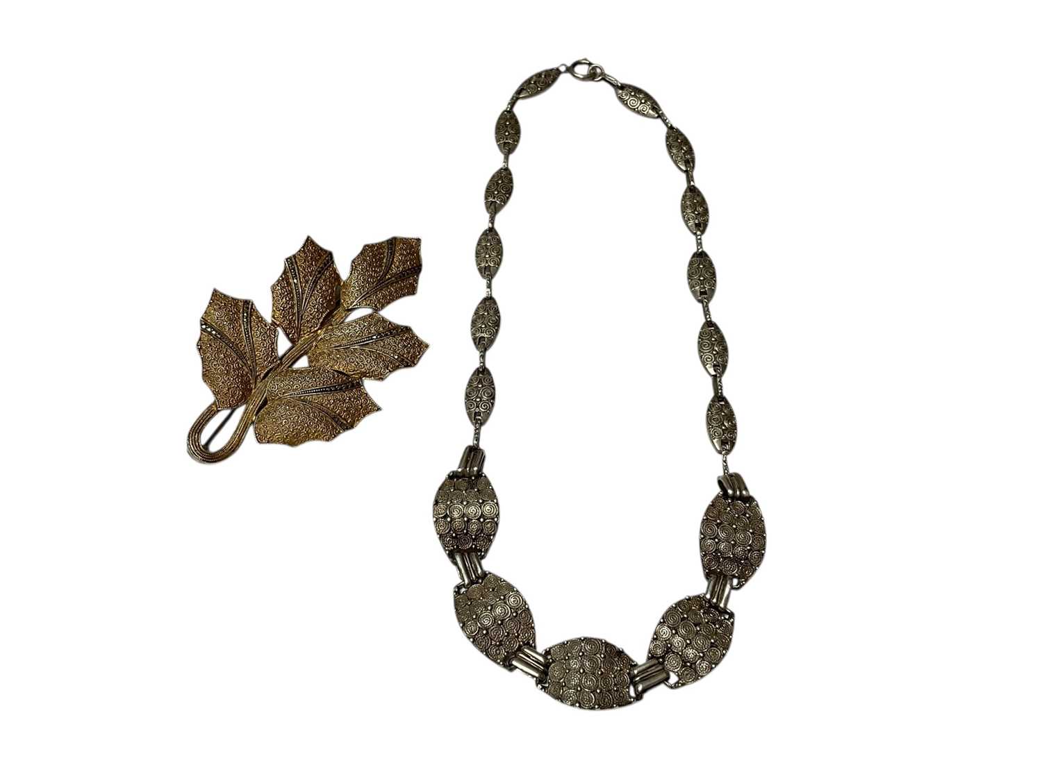 Lot 226 - Art Deco Theodor Fahrner silver panel necklace, together with a similar silver gilt and marcasite leaf brooch