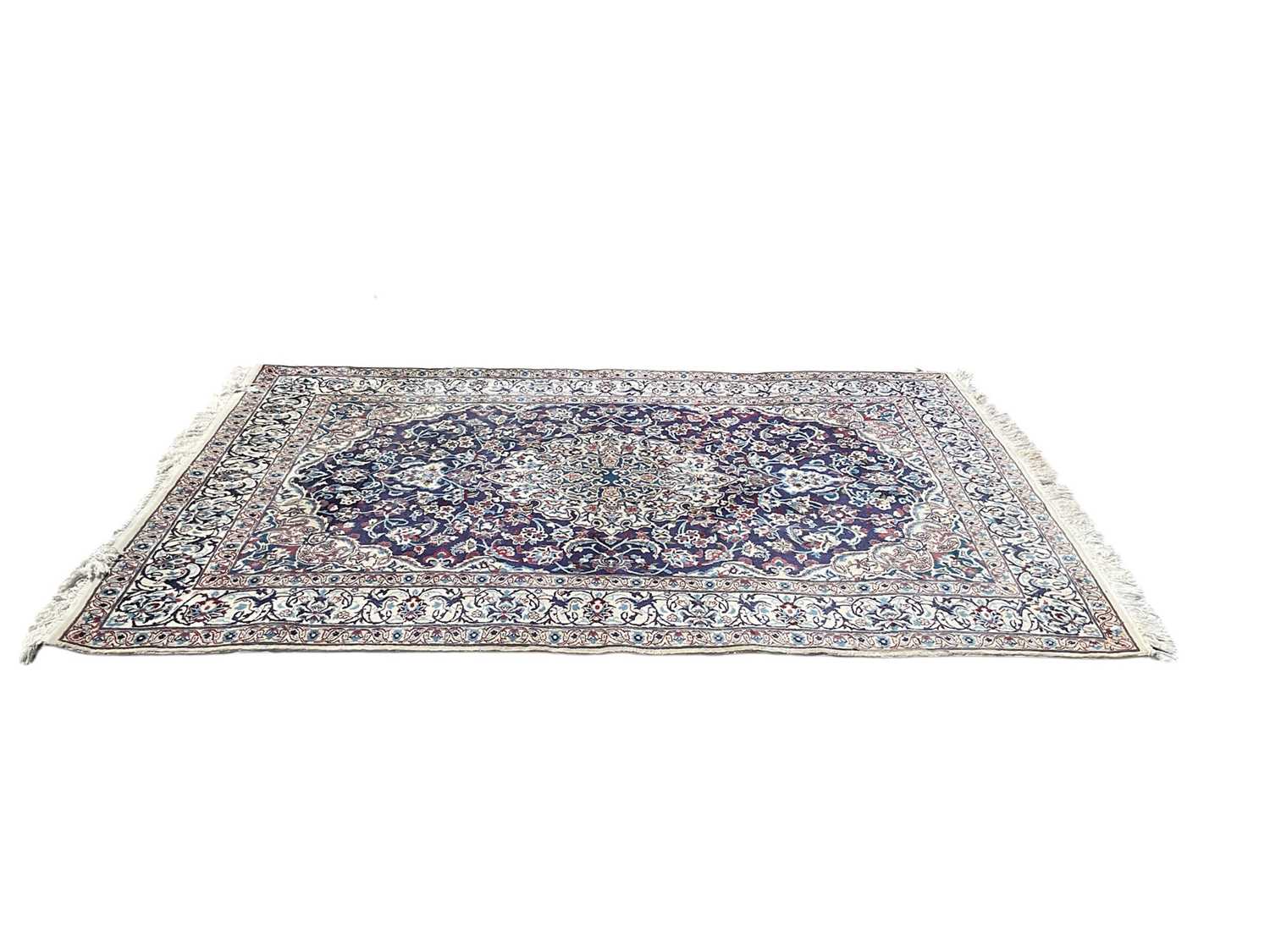 Lot 1316 - Eastern rug with central medallion on red,
