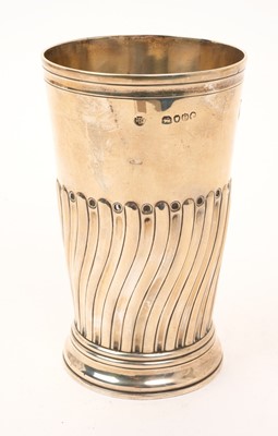 Lot 465 - Victorian silver beaker of tapering form, with wrythen decoration, on a flared circular base (London 1889) Walter & John Barnard. All at approximately 7ozs. 13.5cm overall height