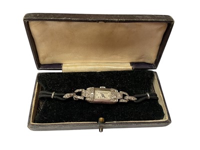 Lot 95 - Art Deco diamond set cocktail watch on black cord bracelet, in box