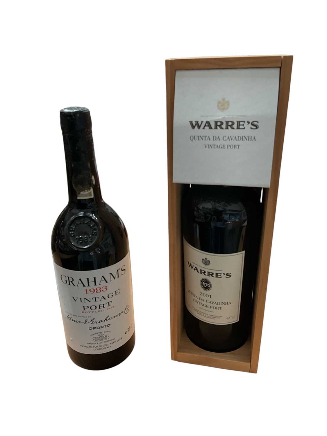 Lot 653 - Warre 2001 Quinta da Cavadinha vintage port in case, and a bottle of Graham's 1983 vintage port (leaking slightly) (2 bottles)