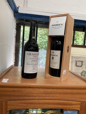 Lot 653 - Warre 2001 Quinta da Cavadinha vintage port in case, and a bottle of Graham's 1983 vintage port (leaking slightly) (2 bottles)