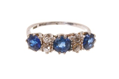 Lot 628 - Antique sapphire and diamond ring with three mixed cut blue sapphires and four old cut diamonds