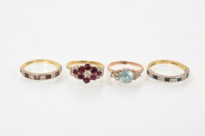Lot 629 - Ruby and diamond cluster ring, Ruby and diamond eternity ring, sapphire and diamond eternity ring and a blue zircon ring