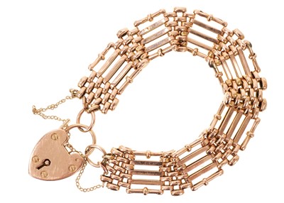 Lot 694 - Edwardian 15ct rose gold gate bracelet with padlock clasp