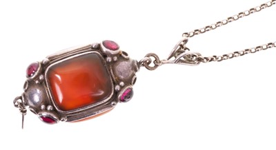 Lot 695 - Arts & Crafts silver pendant with cabochon garnets and carnelian