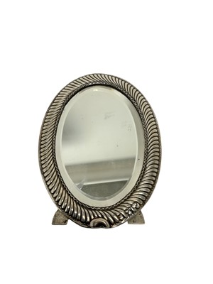 Lot 560 - Oval silver framed mirror