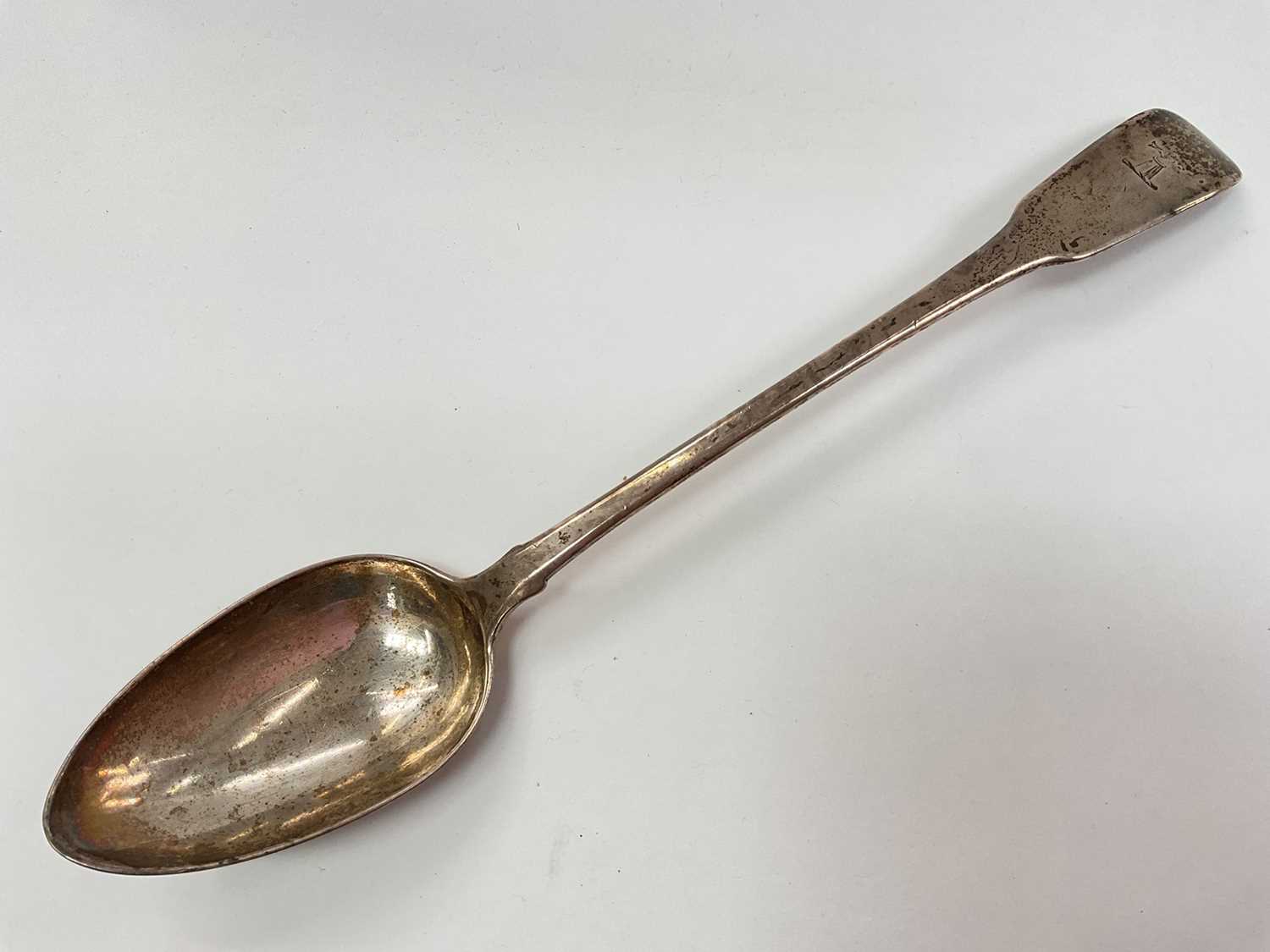 Lot 1141 - Georgian silver serving spoon with engraved crest (London 1806)
