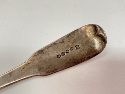 Lot 1141 - Georgian silver serving spoon with engraved crest (London 1806)