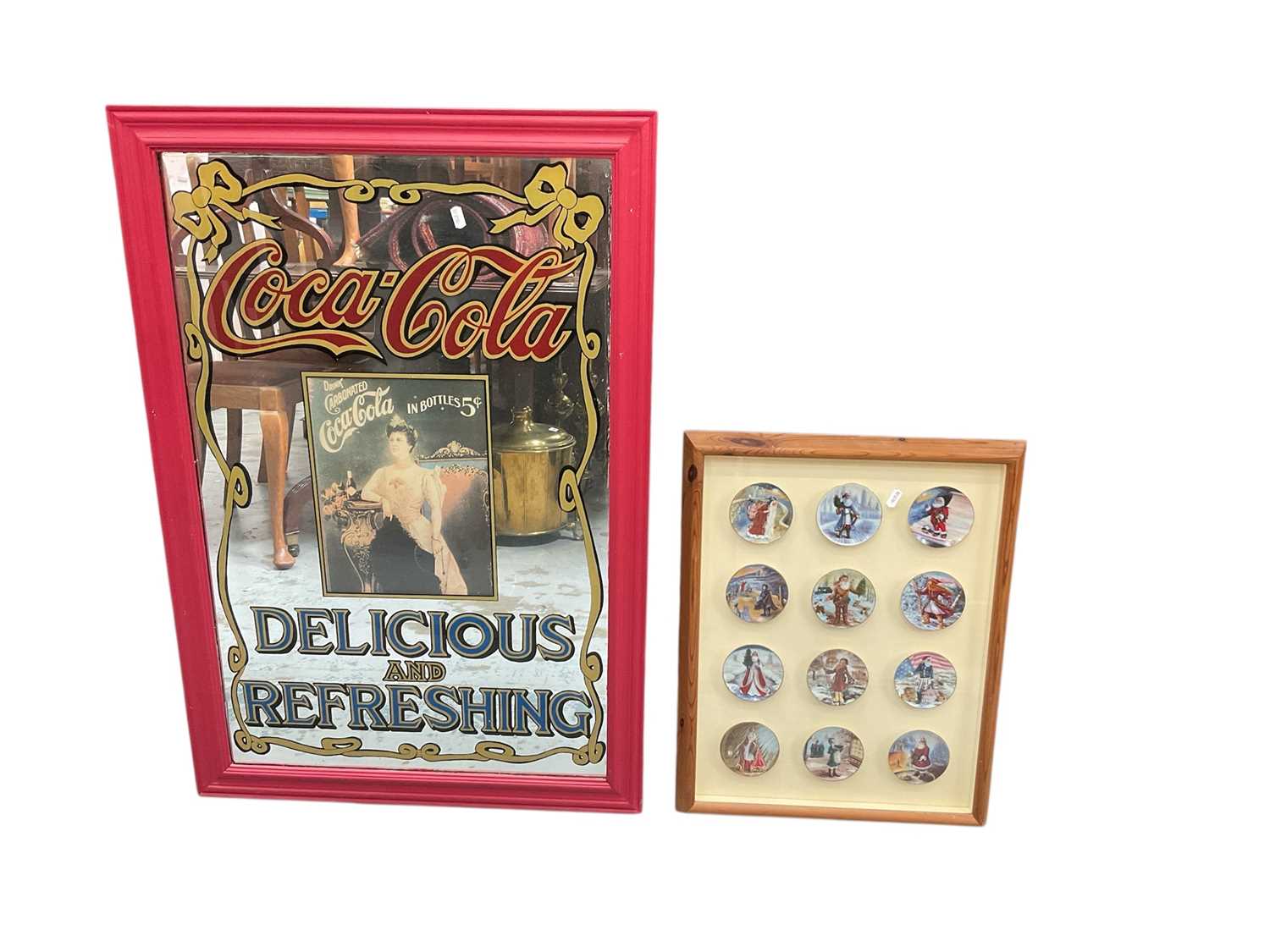 Lot 848 - Large Coca Cola framed mirror approximately 96cm x 65cm together with 12 small collector plates in a pine glazed frame
